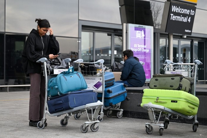 People with their bags outside terminal 4