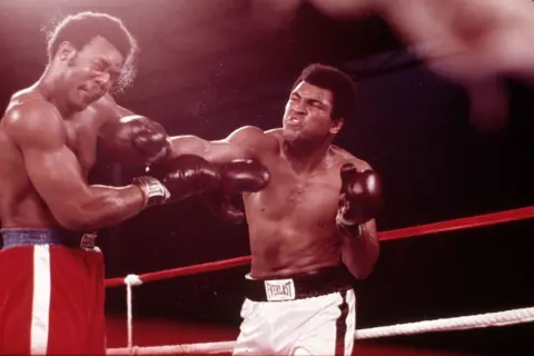 Getty Images George Foreman (left) and Muhammad Ali boxing at Zaire Stade in the Rumble in the Jungle, 30 October 1974.