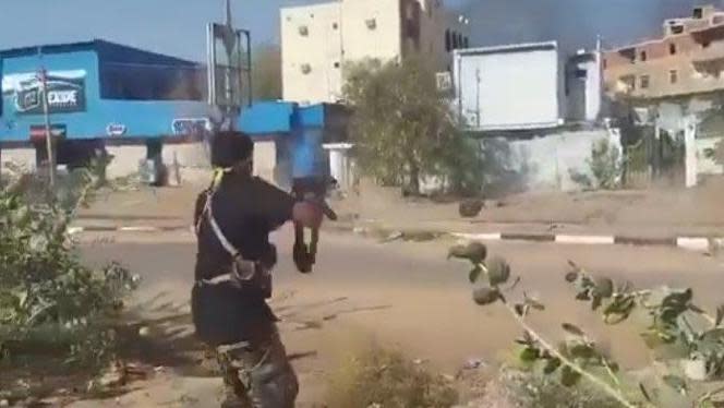 Men firing on RSF fighters attempting to flee on motorbike