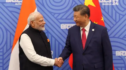 Press Information Bureau Indian Prime Minister Narendra Modi shakes hands with Chinese President Xi Jinping before their meeting on the sidelines of the BRICS summit in Kazan, Russia, October 23, 2024.