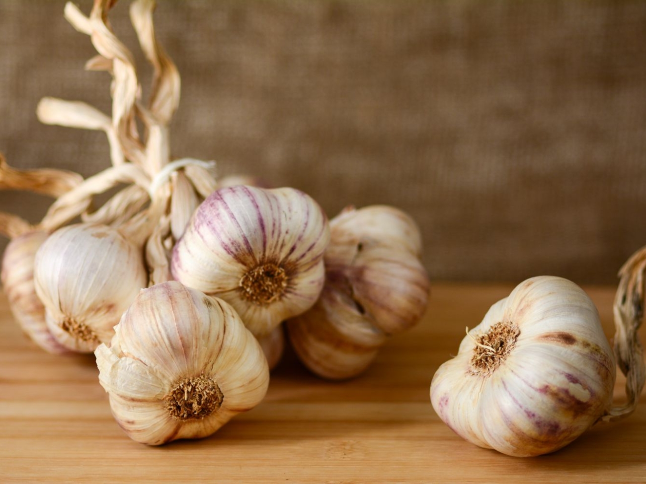 ms-garlic-bulbs-woodensurface-getty-30bcff1a96224352b2f3a4b7789dfb9c.jpg