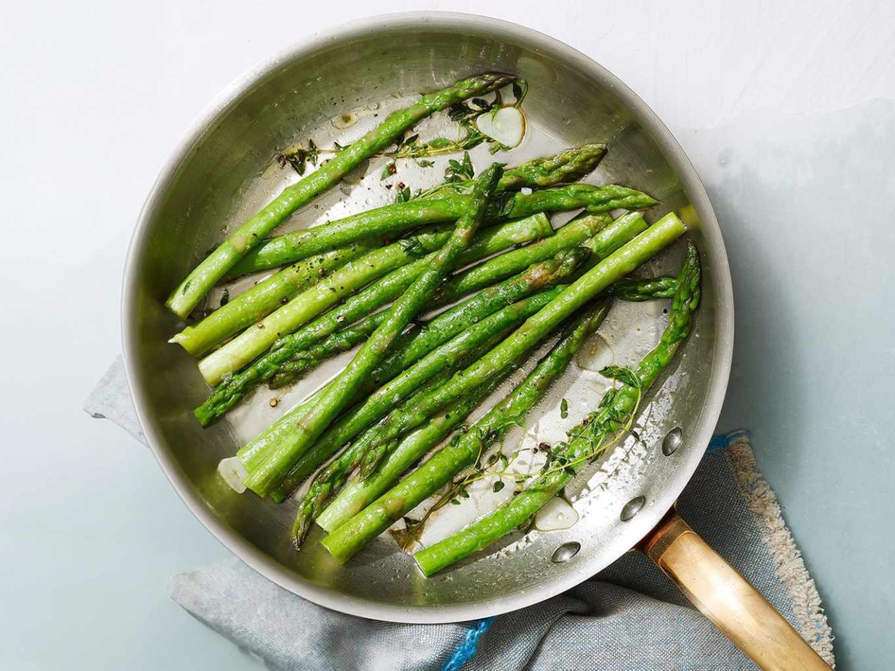 sauteed-asparagus-garlic-thyme-d66e5392-0520-onecms-5bf3cdfb9c04488895ccc3877ca5972c-ea7e677ccccc489.jpeg